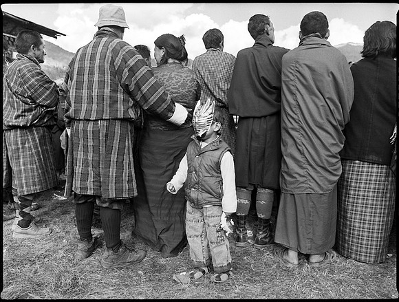 Boy and Spectators